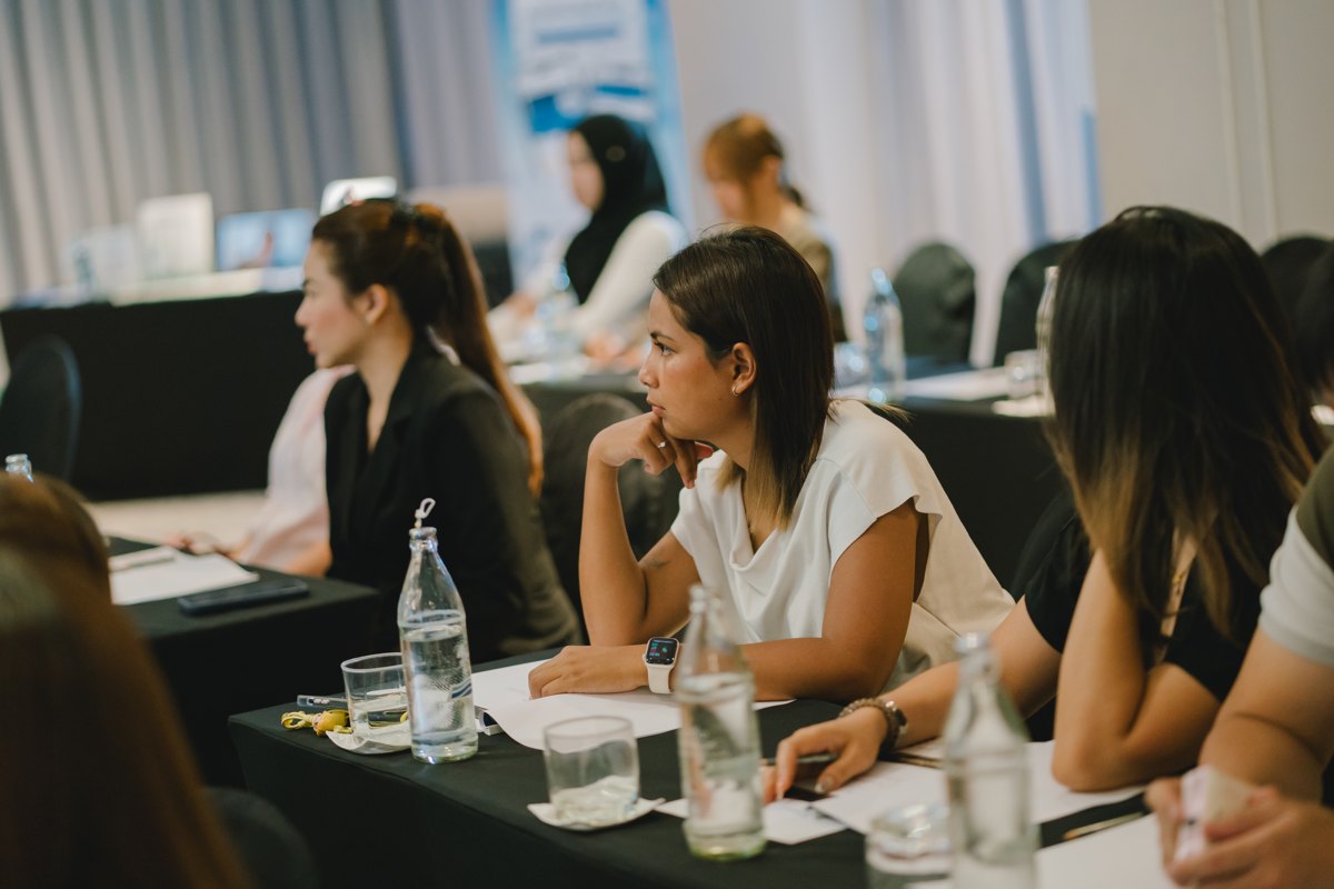 Attendees following the session